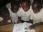 Mkurumuzi 4 pupils reading&nbsp;book