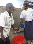 Mkurumuzi Primary School – pupils at hand&nbsp;tank